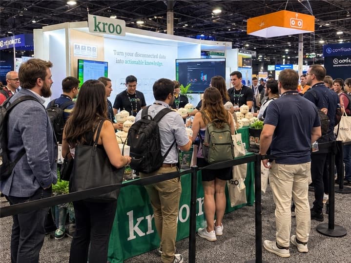 A queue behind a stanchion at a conference booth where branded coconuts are being handed out